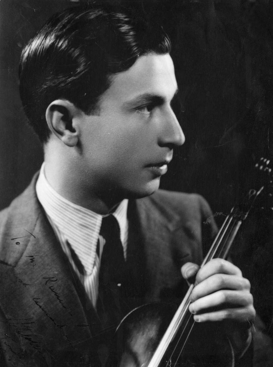 A photograph of American virtuoso violinist Nathan Milstein from Olaf T. Ranum's "artist wall." Ringve Musikkmuseum, Trondheim, Norway. (Public Domain)