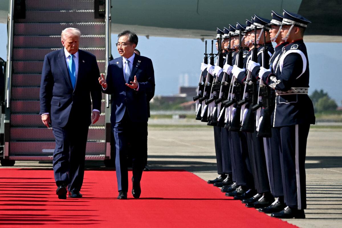 U.S. President Donald Trump is greeted by South Korean Foreign Minister Cho Hyun upon his arrival at the airport in Gyeongju, South Korea, on Oct. 29, 2025. (Andrew Caballero-Reynolds/AFP via Getty Images)