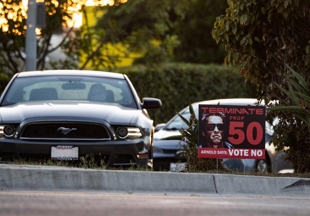 Traffic drives past a sign advertising against California's Proposition 50 in Los Angeles, on Oct. 28, 2025. (John Fredricks/The Epoch Times)