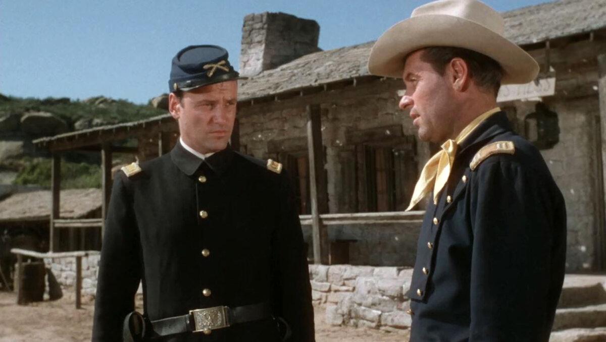 Lt. Beecher (Richard Anderson) disagrees with the methods of Capt. Roper (William Holden), in “Escape from Fort Bravo.” (MGM)