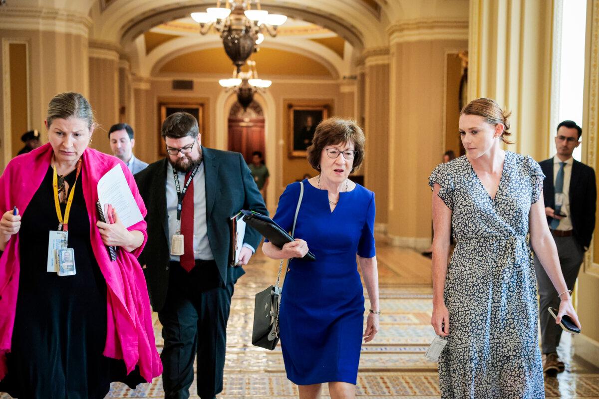 Sen. Susan Collins (R-Maine) walks with her staff in the U.S. Capitol in Washington on July 28, 2025. Collins is among the Republicans who have expressed openness to altering the filibuster but said Feb. 13 she wasn't willing to do that to pass the SAVE Act, which she supports. (Anna Moneymaker/Getty Images)