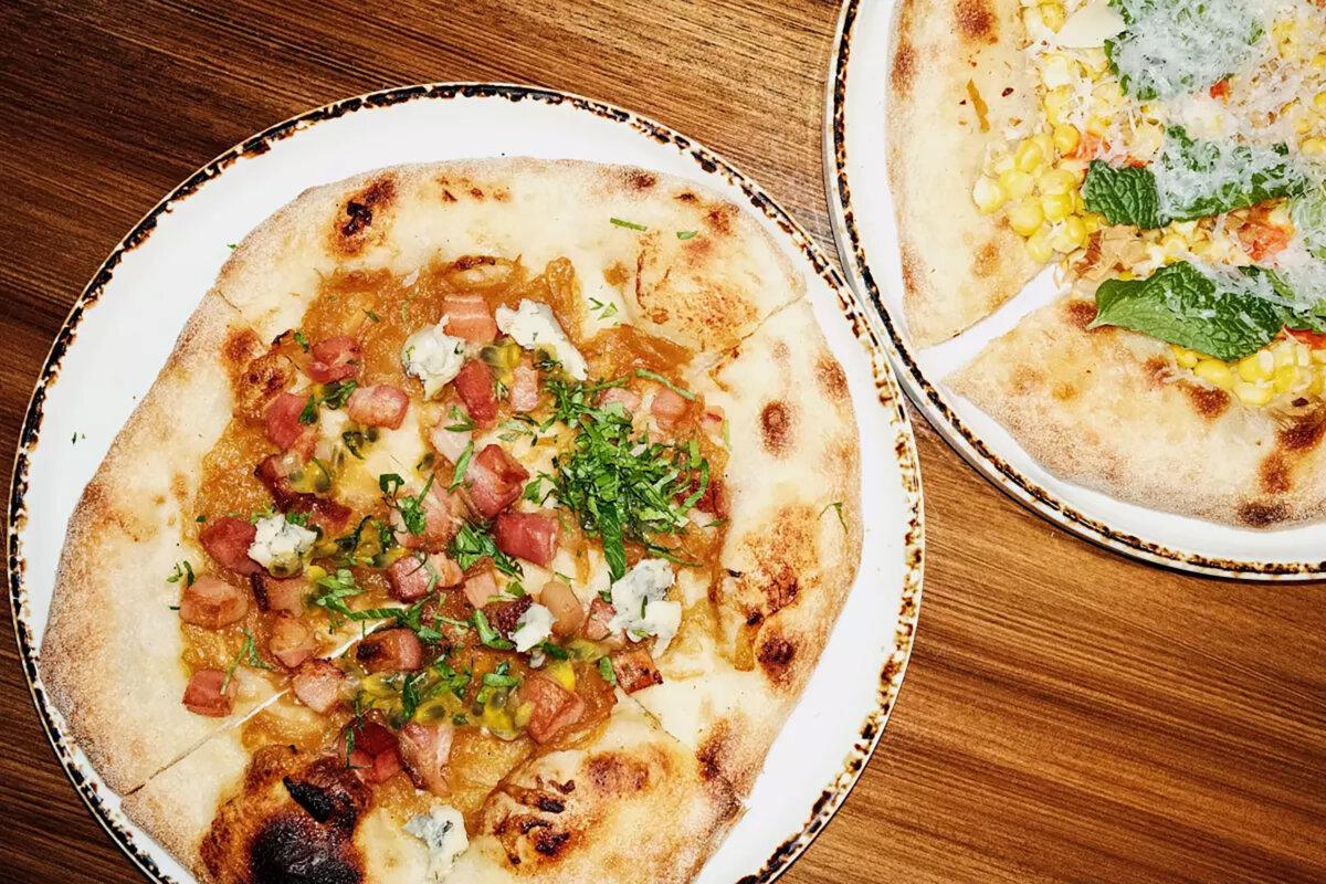 Spanish restaurant Casa Leo in Los Feliz serves wine, tapas and cocas, or Iberian flatbreads, topped with the likes of lardons, queso, caramelized onions, passion fruit, corn and more. (Stephanie Breijo/Los Angeles Times/TNS)