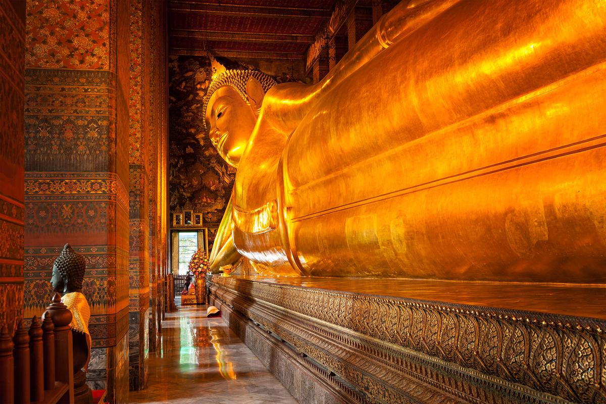 The Reclining Buddha is housed in Wat Pho, one of Bangkok's oldest and largest temples. Wat Pho is also known as the birthplace of traditional Thai massage. (f9photos/Getty Images)