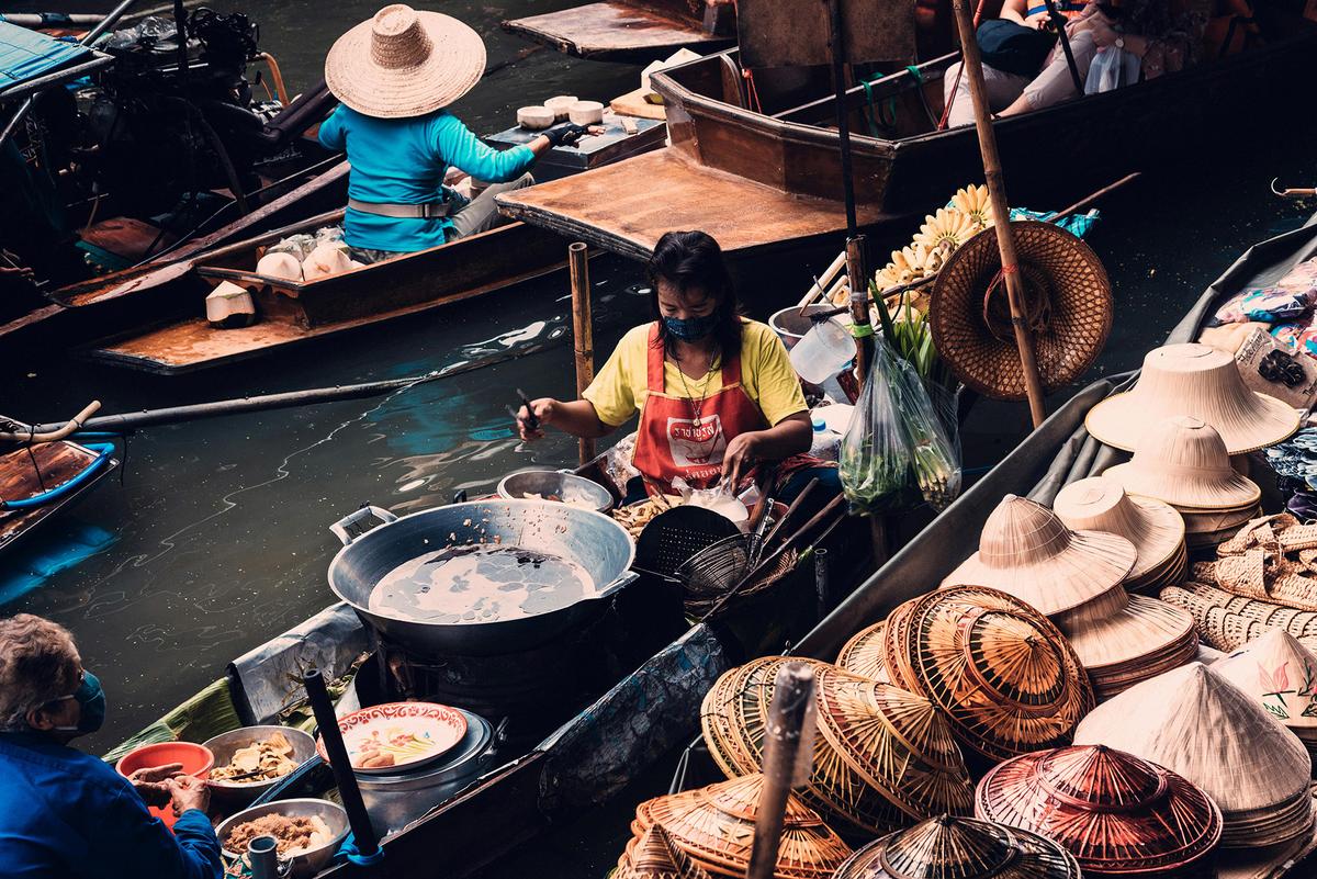 Boats are widely used in Bangkok for both commerce and travel. (Arnie Chou/Pexels)