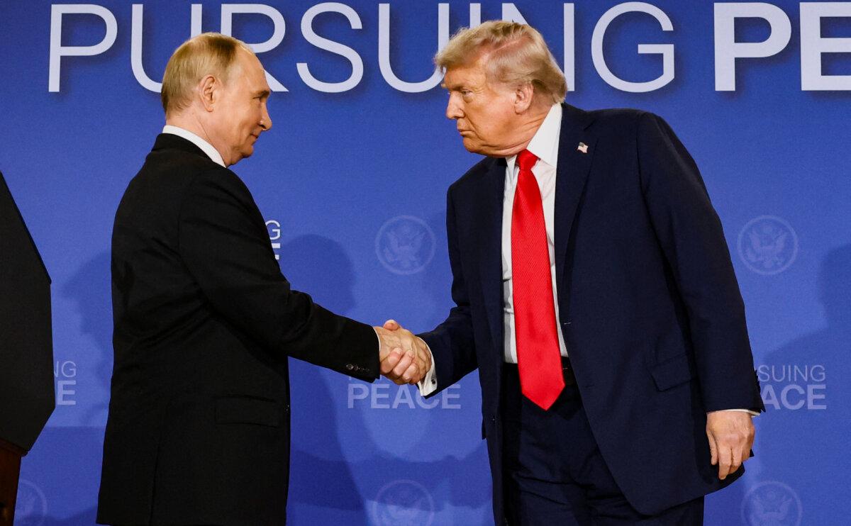U.S. President Donald Trump (R) and Russian President Vladimir Putin shake hands at Joint Base Elmendorf-Richardson, in Anchorage, Alaska, on Aug. 15, 2025. (Kevin Lamarque/Reuters)
