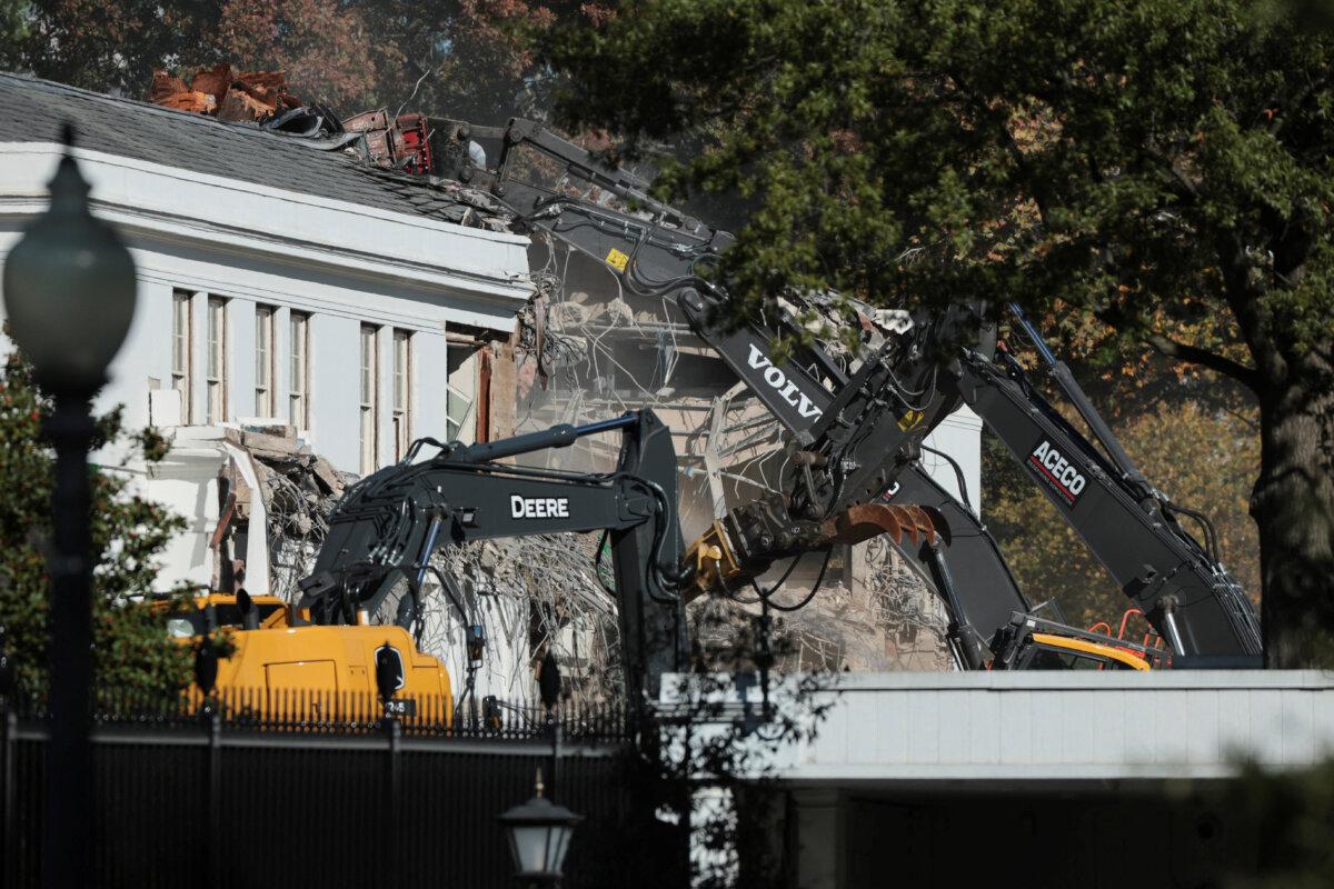 A demolition crew takes apart the facade of the East Wing of the White House, where President Donald Trump's proposed ballroom is being built, on Oct. 21, 2025. (Jonathan Ernst/Reuters)