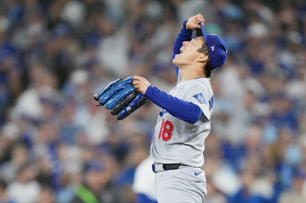 Los Angeles Dodgers pitcher Yoshinobu Yamamoto celebrates after the Dodgers defeated the Toronto Blue Jays in Game 7 of baseball's World Series, Sunday, Nov. 2, 2025, in Toronto. (Nathan Denette/The Canadian Press via AP)