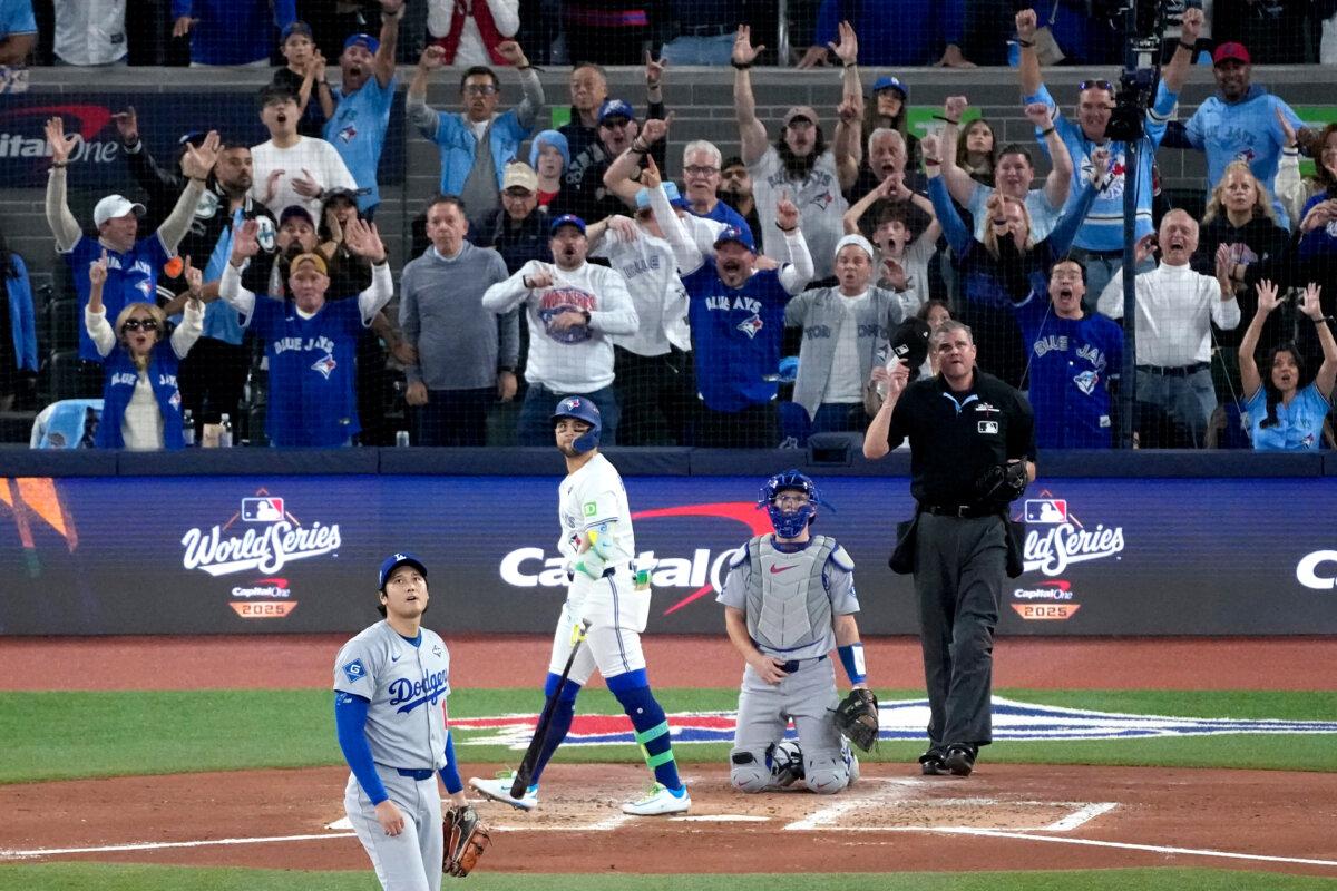 Toronto Blue Jays' Bo Bichette watches his three run home run off Los Angeles Dodgers' Shohei Ohtani leave the park during the third inning in Game 7 of baseball's World Series in Toronto on Nov. 1, 2025. (Ashley Landis/AP Photo)