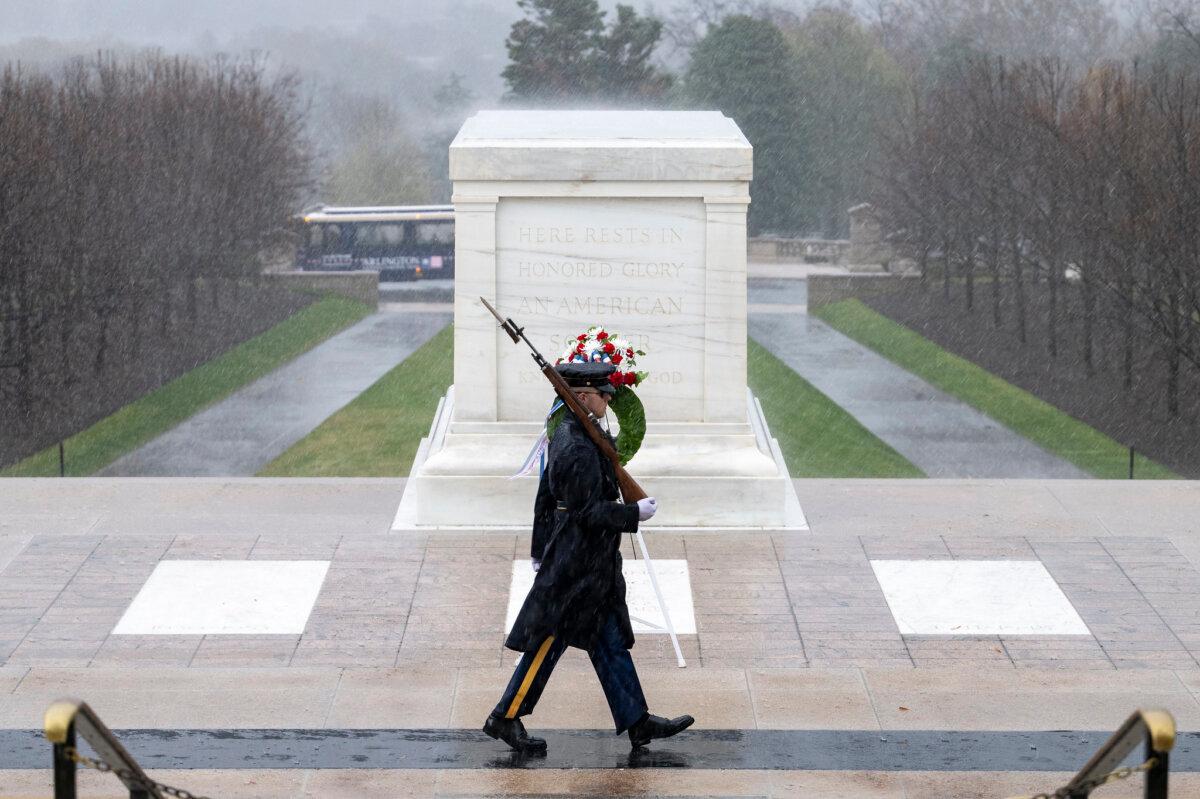 Come rain or shine, sentinels from the 3rd U.S. Infantry Regiment guard the Tomb of the Unknown Soldier at Arlington National Cemetery, Arlington, Va. U.S. Army photo by Elizabeth Fraser/ Arlington National Cemetery. (Public Domain)