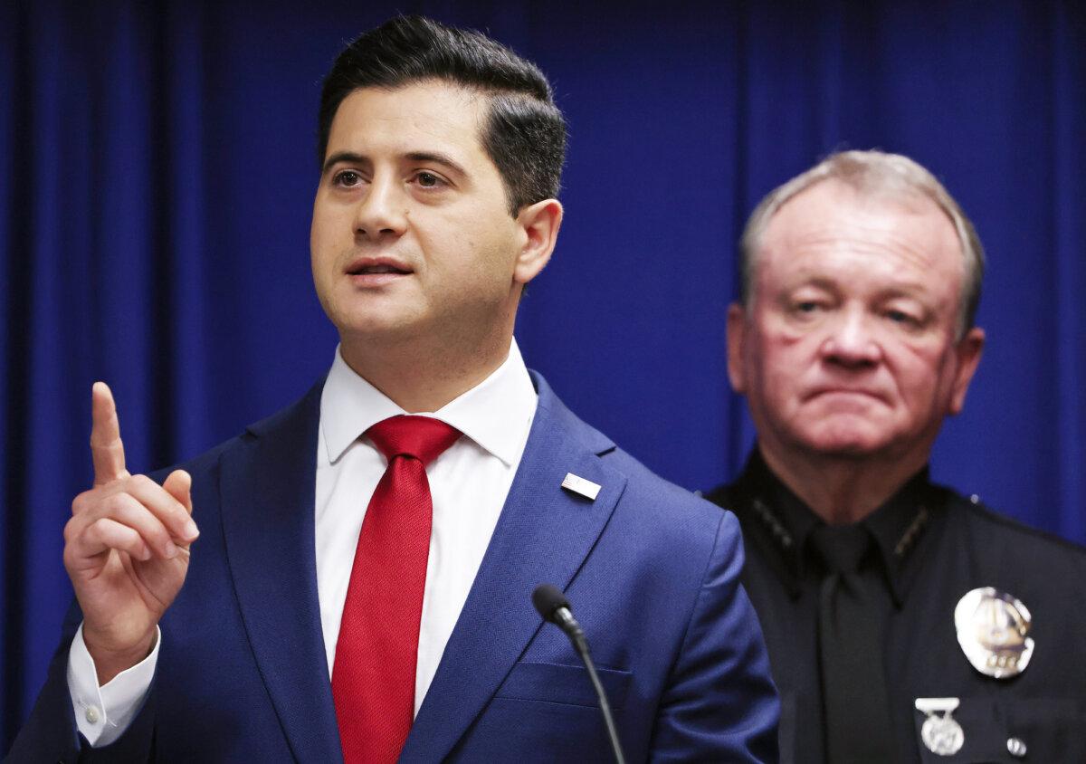 Acting U.S. Attorney Bill Essayli (L) speaks as Los Angeles Police Department Chief Jim McDonnell looks on at a press conference in Los Angeles on Oct. 8, 2025. (Mario Tama/Getty Images)