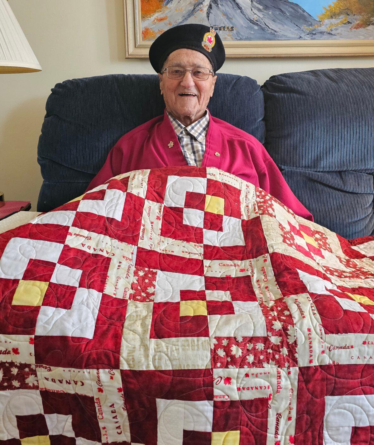 Mel Mizzi, pictured at his home with a "Quilt of Valour" presented to him by the Quilts of Valour Canada Society. The quilts are made by volunteer quilters from across the country who wish to show their appreciation to Canadian Armed Forces members, past and present, for their bravery and commitment to Canada. (Courtesy Christine Marasco)