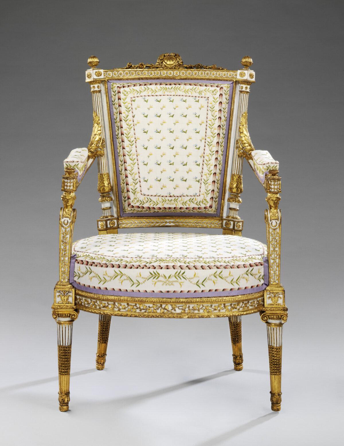 Marie Antoinette’s armchair, 1788, by Jean-Baptiste-Claude Sené. Carved, painted, and gilded walnut. (Copyright Victoria and Albert Museum, London)
