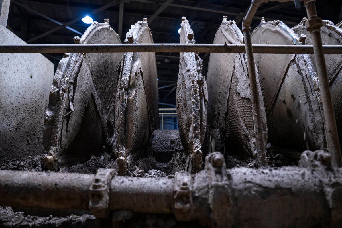 Shredders chop through a solvent-ore mix at Empire State Mines in Gouverneur, N.Y., in November 2025, where a mine that produces graphite, a critical mineral, may also soon be mining geranium, a rare-earth element. (Madalina Kilroy/The Epoch Times)