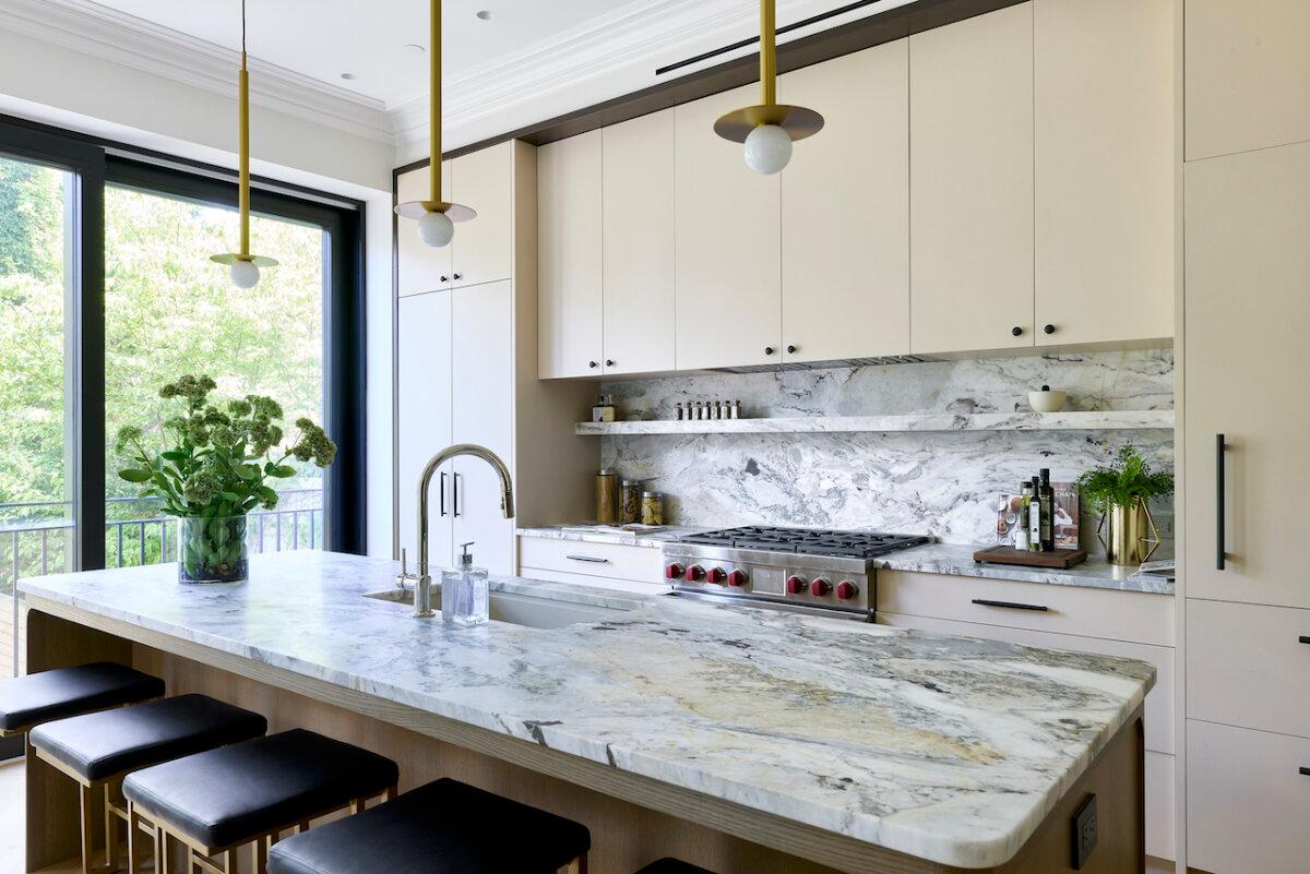 Grocery store finds such as oils, spices, and cook books make for the ideal touch for the staging of this kitchen. (Handout/TNS)
