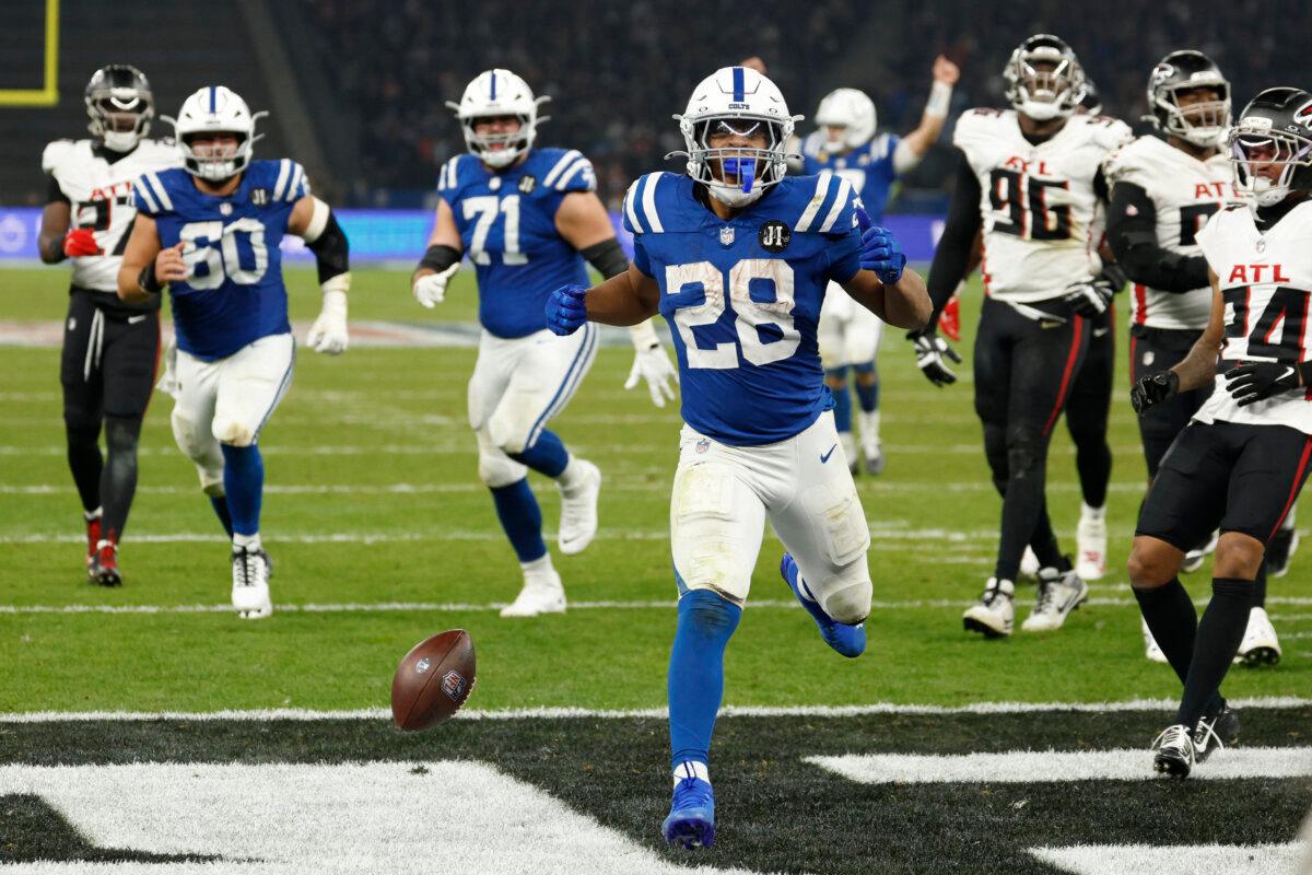 Indianapolis Colts' running back Jonathan Taylor runs to the winning touchdown during the NFL match between the Indianapolis Colts and the Atlanta Falcons at the Olympic Stadium in Berlin, Germany, on Nov. 9, 2025. (Odd Andersen/AFP via Getty Images)
