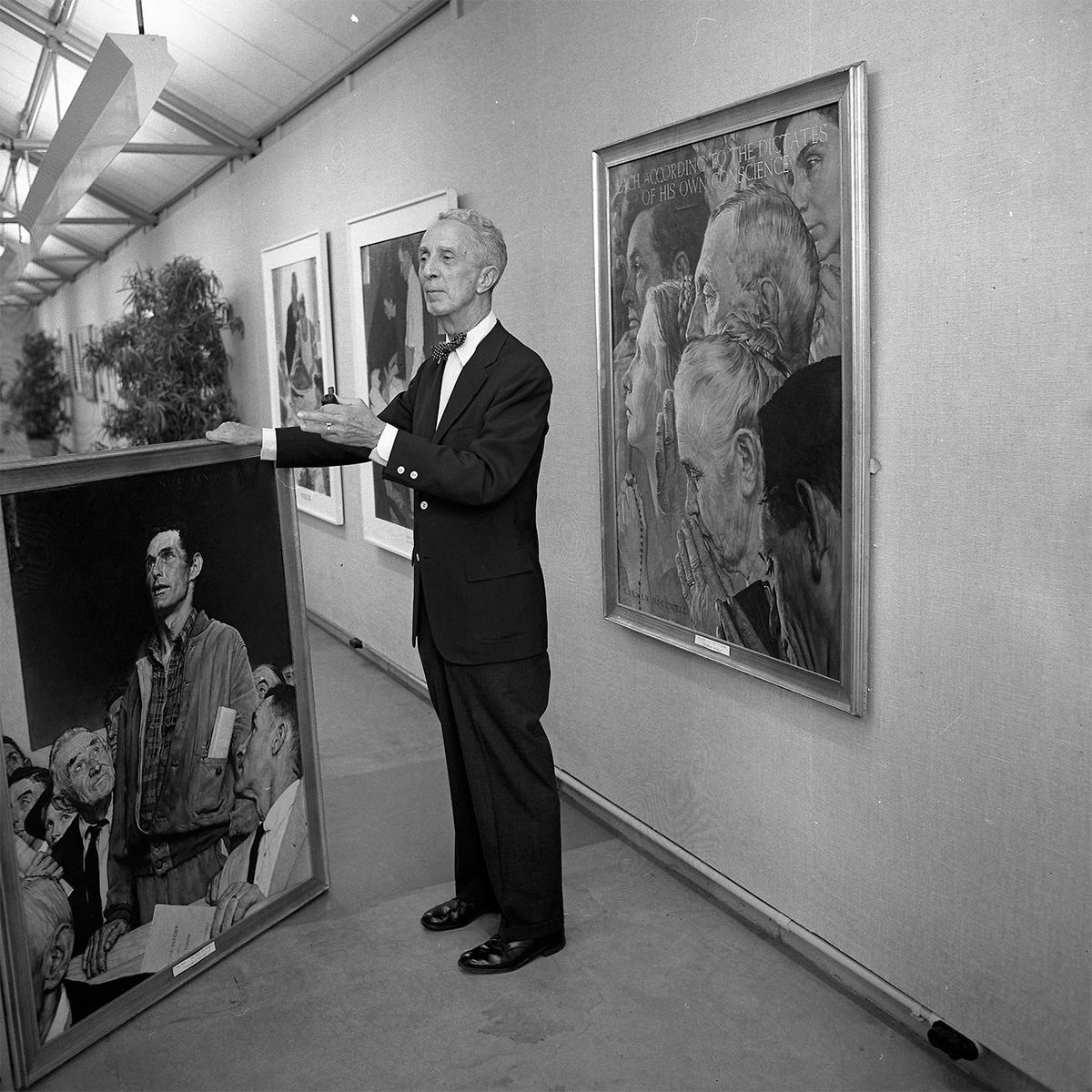 Norman Rockwell stands beside his large-scale paintings of the "Four Freedoms" at the Municipal Art Gallery in Los Angeles, 1965. (<a href="https://commons.wikimedia.org/wiki/File:Norman_Rockwell_at_Municipal_Art_Gallery_at_Barnsdall_Park.jpg" target="_blank" rel="nofollow noopener">Los Angeles Times</a>/<a href="https://creativecommons.org/licenses/by/4.0/" target="_blank" rel="nofollow noopener">CC BY 4.0</a>)