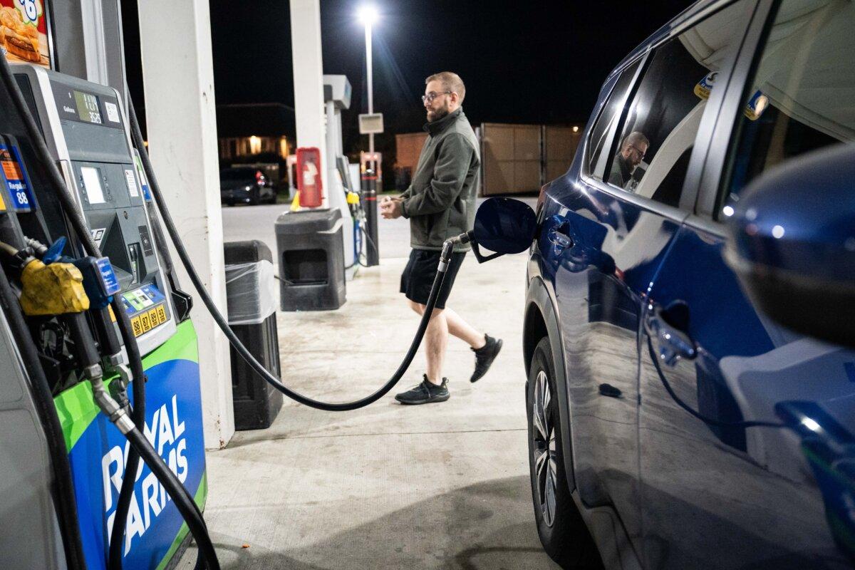 A man pumps gas at a gas station in Elkridge, Md., on Nov. 12, 2025. (Madalina Kilroy/The Epoch Times)