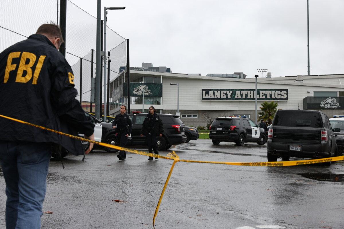 Law enforcement works the scene after a shooting at Laney College in Oakland, Calif., on Nov. 13, 2025. (Santiago Mejia/San Francisco Chronicle via AP)