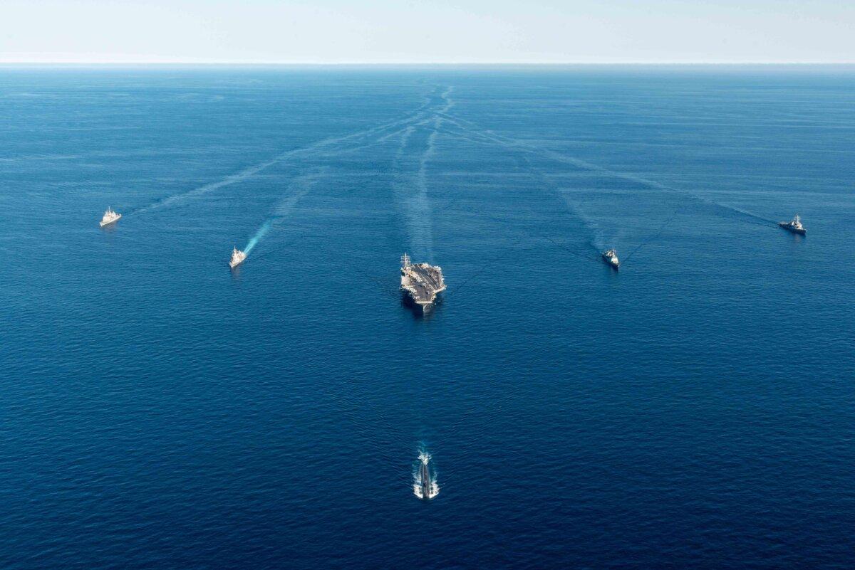 Submarine USS Annapolis (front), U.S. nuclear-powered aircraft carrier Ronald Reagan (C), and South Korean and Japanese warships during a combined trilateral anti-submarine exercise in the East Sea off South Korea on Sept. 30, 2022. (South Korean Defense Ministry via Getty Images)