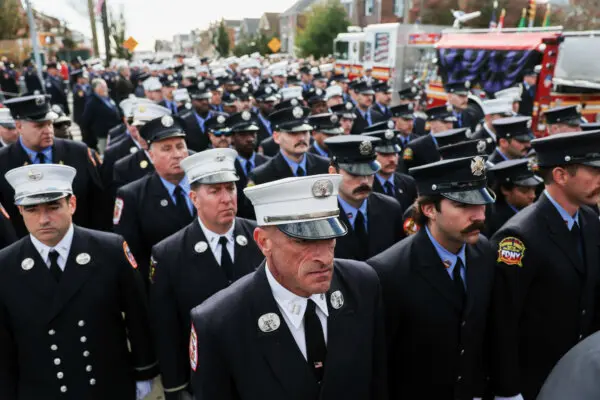 Day in Photos: Firefighter’s Funeral, Flooding in the UK, and Explosion in Argentina