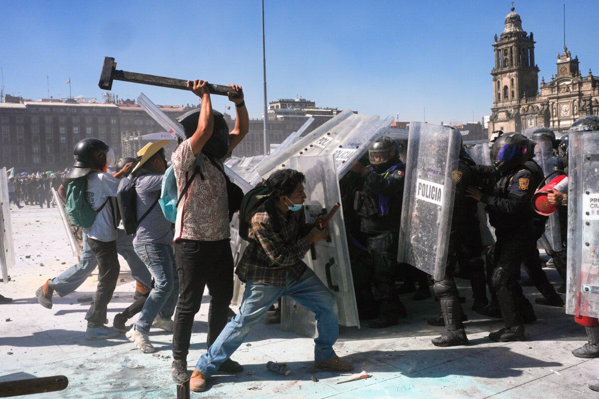 Protesters charge at police during a youth anti-government march in Mexico City on Nov. 15, 2025. (Marco Ugarte/AP Photo)