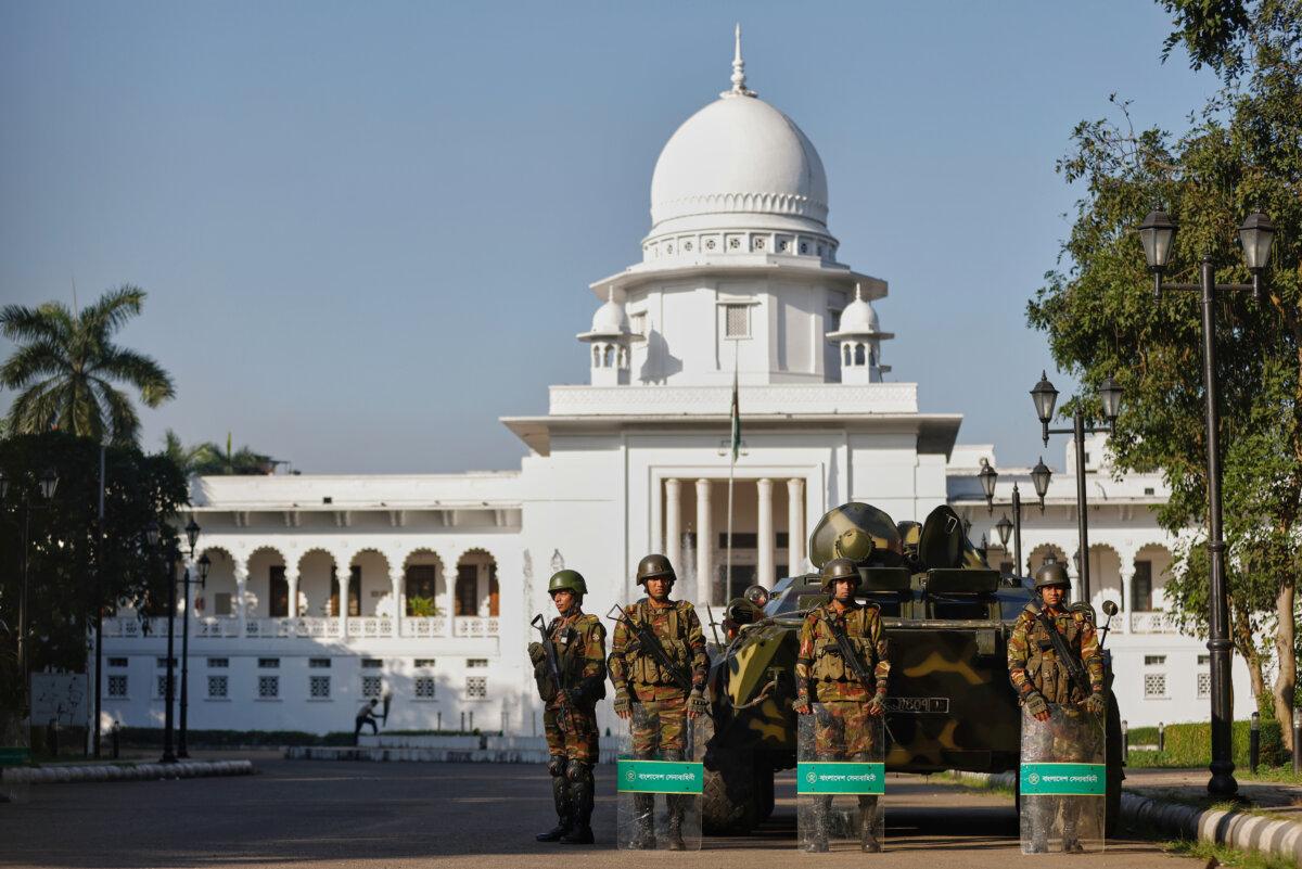 Bangladeshi Army soldiers stand guard outside the Supreme Court after security was beefed up across the country ahead of an expected verdict against ousted Prime Minister Sheikh Hasina, in Dhaka, Bangladesh, on Nov. 17, 2025. (AP Photo/Rajib Dhar)
