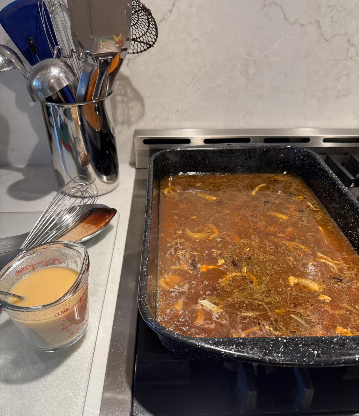 The drip pan beneath the roasted turkey holds concentrated flavor and forms the foundation for superior gravy. (JeanMarie Brownson/TCA)