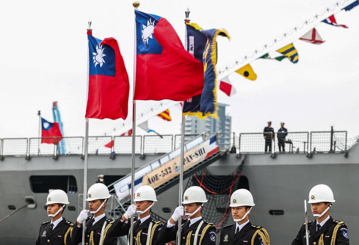 Taiwanese honor guards hold Taiwanese flags during an open day event for the public at the Keelung port on March 17, 2025. (I-haw Cheng /AFP via Getty Images)