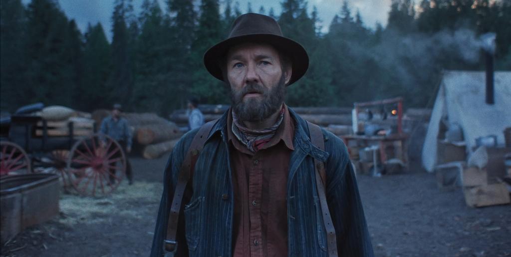 Robert Grainier (Joel Edgerton) at work, in "Train Dreams." (Black Bear Pictures)