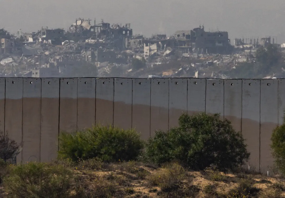 Inside the Multinational Center in Israel That Distributes Aid to Gaza | USNN World News The skyline of the city of Beit Lahia, Gaza is seen from over the Israeli border wall, on Nov. 19, 2025. (John Fredricks/The Epoch Times)