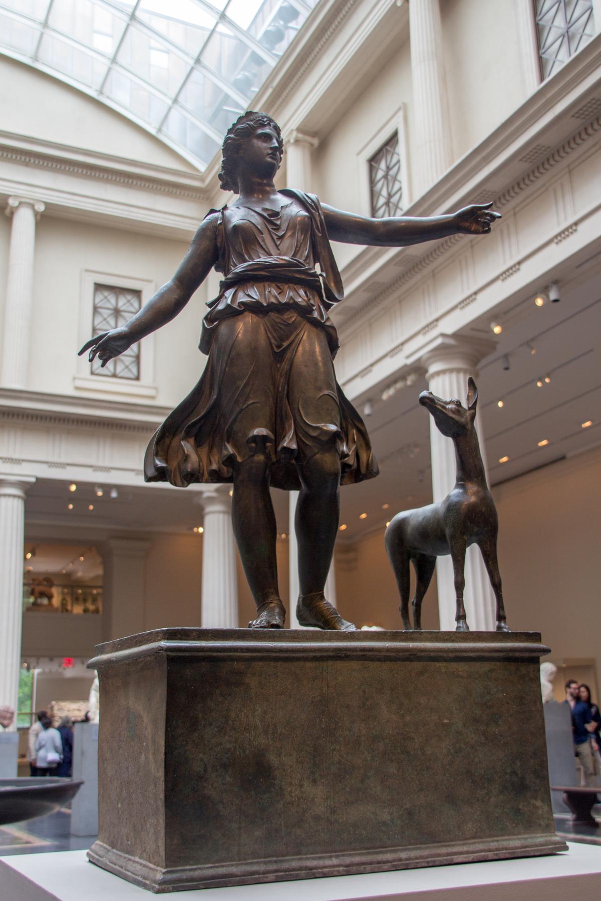 A bronze statue of "Artemis and a Deer," circa 1st century B.C. to A.D. 1st century, in Greece's Late Hellenistic or Early Imperial period. Bronze; 36 1/4 inches tall. The Metropolitan Museum of Art, New York City. (<a href="https://commons.wikimedia.org/wiki/User:Mike_Peel">Mike Peel</a>/<a href="https://creativecommons.org/licenses/by-sa/4.0/deed.en" target="_blank" rel="nofollow noopener">CC BY-SA 4.0</a>)