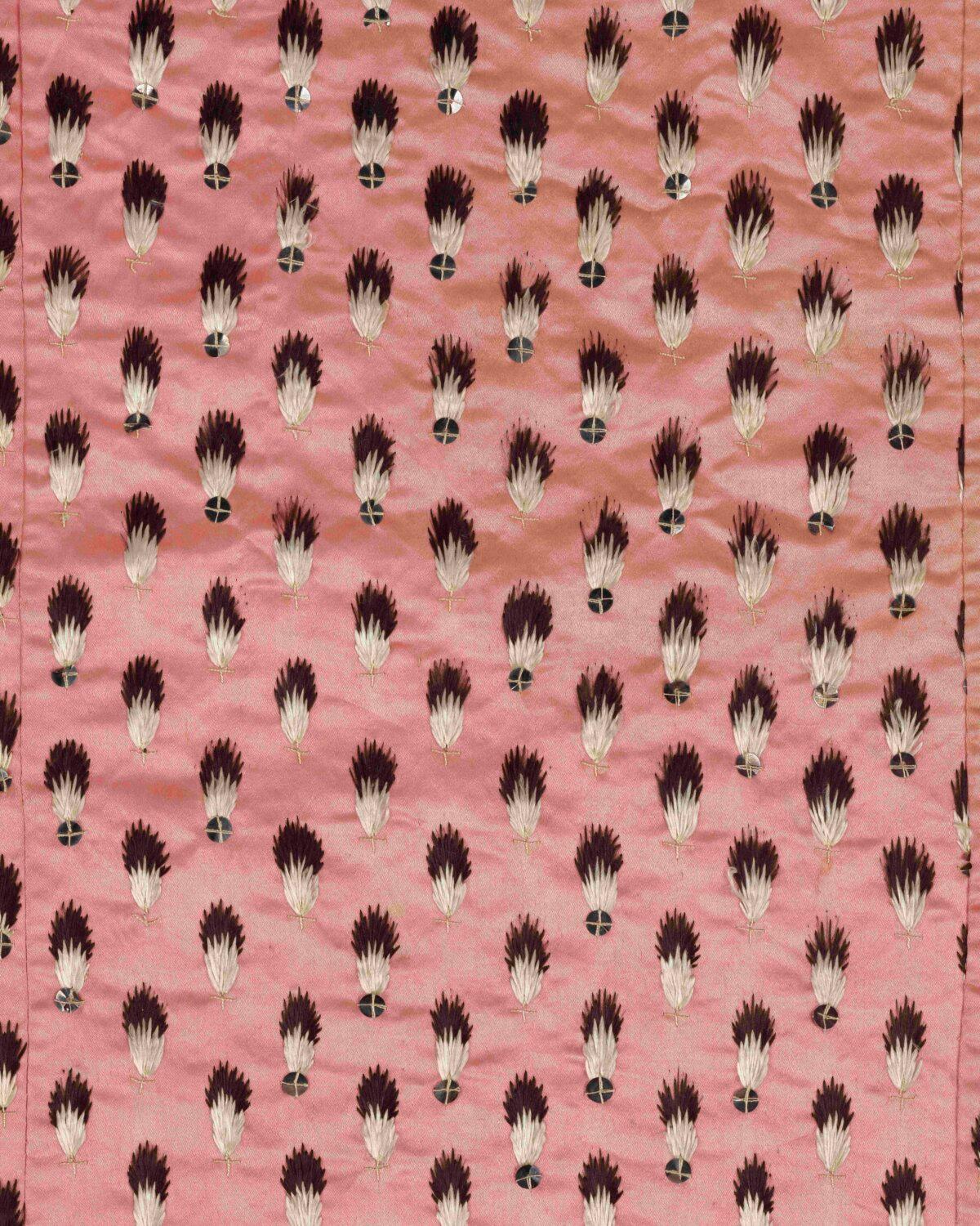 Fragments of a petticoat from an open, close-bodied court gown, probably Marie Antoinette’s, circa 1780–1791. French, salmon-pink silk satin with solid silver spangles and embroidered embellishments to resemble ermine. (Copyright Victoria and Albert Museum, London)