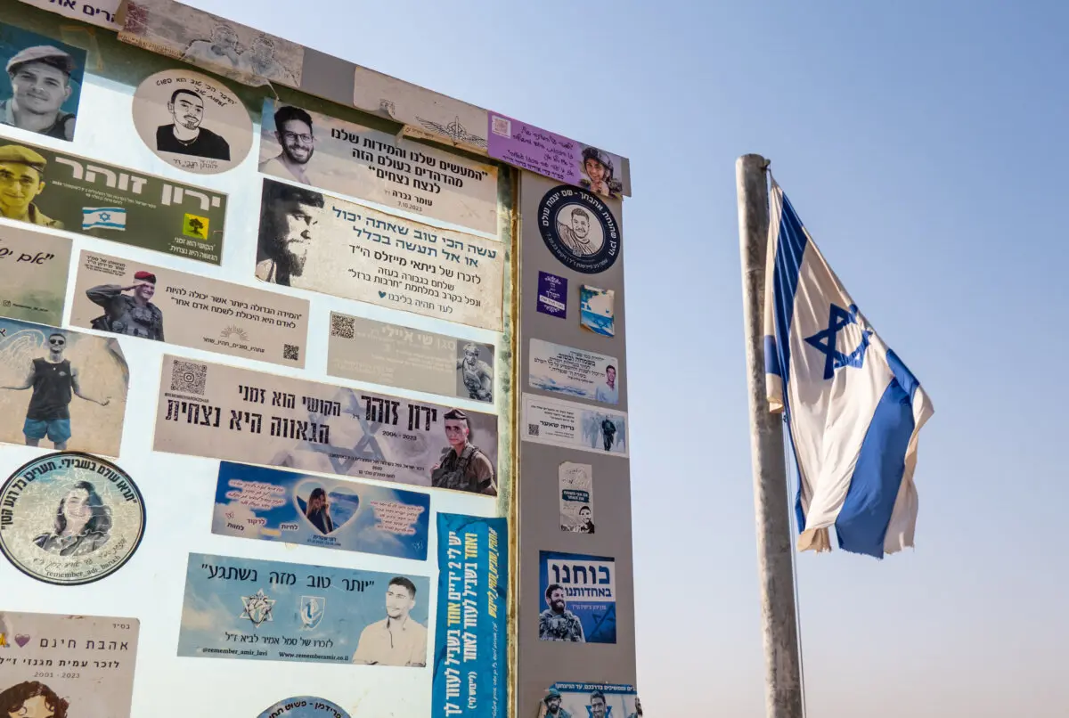 Inside the Multinational Center in Israel That Distributes Aid to Gaza | USNN World News Stickers are placed in memory of fallen Israeli Defense Force personnel in Sderot, Israel, on Nov. 19, 2025. (John Fredricks/The Epoch Times)