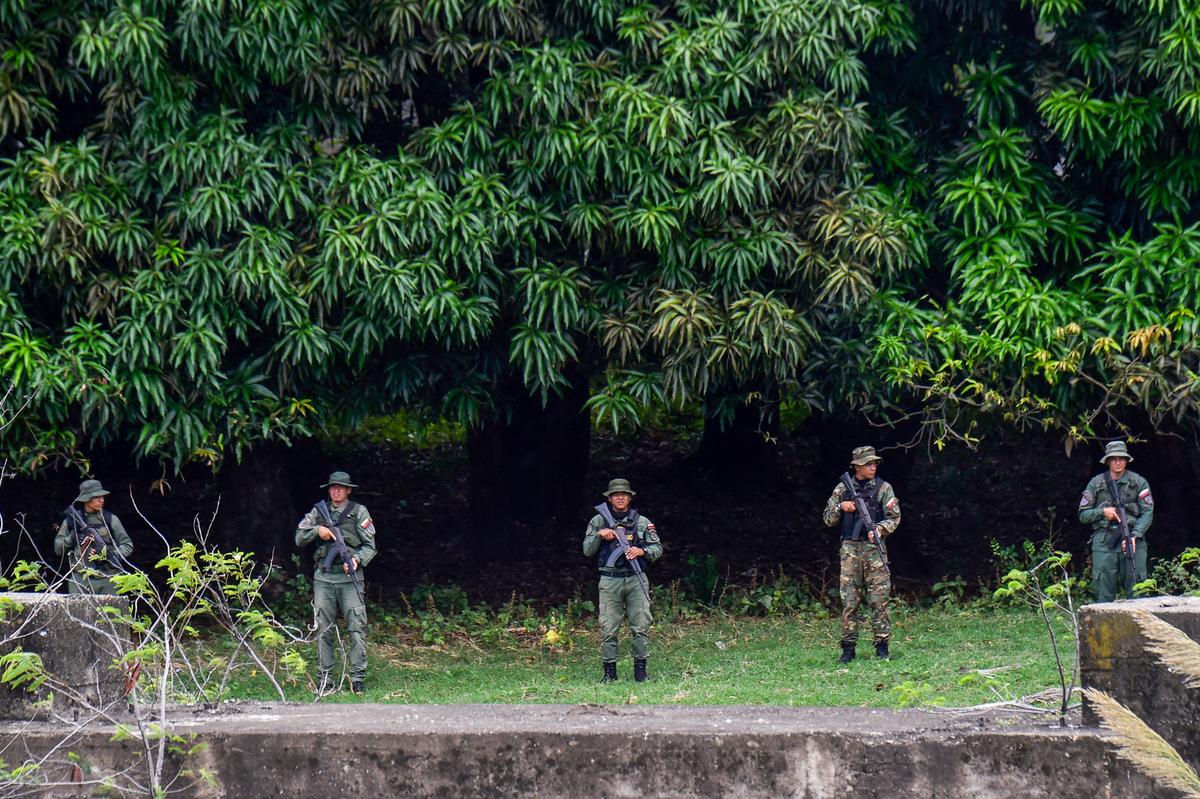 Venezuelan military members patrol around the Simon Bolivar International Bridge at the Colombia–Venezuela border as seen from Villa del Rosario, Colombia, on Oct. 16, 2025. (Schneyder Mendoza/AFP via Getty Images)