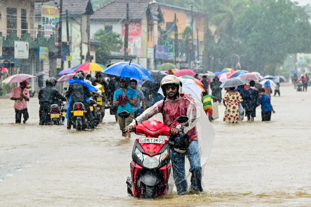Day in Photos: Floods in Asia, Presidential Elections in Honduras, and Cars Exhibition
