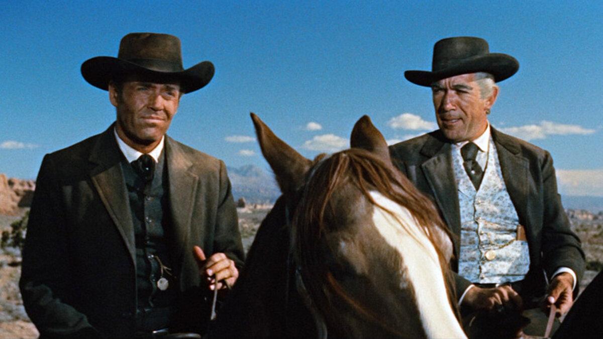 Clay Blaisedell (Henry Fonda, L) and Tom Morgan (Anthony Quinn) eye the town of Warlock like hawks, in “Warlock.” (20th Century Fox)