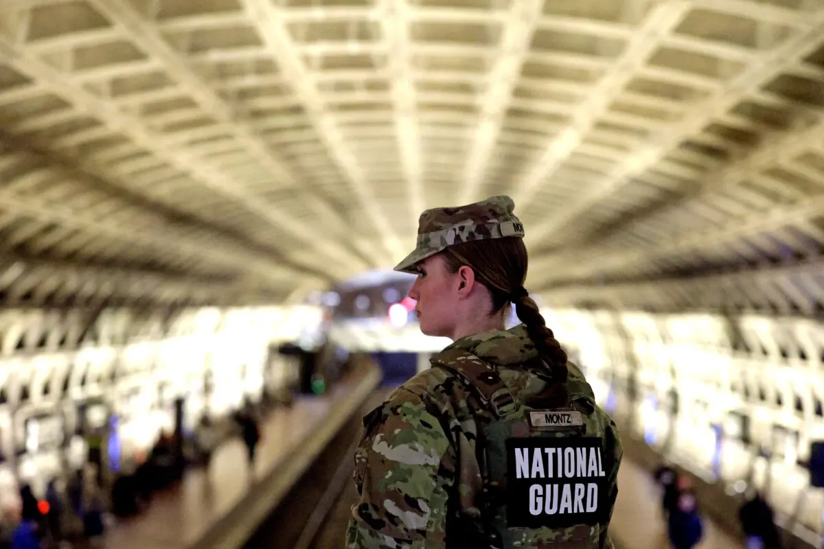 A member of the National Guard patrols at Gallery Place Metro Station in Washington on Dec. 3, 2025. (Alex Wong/Getty Images)