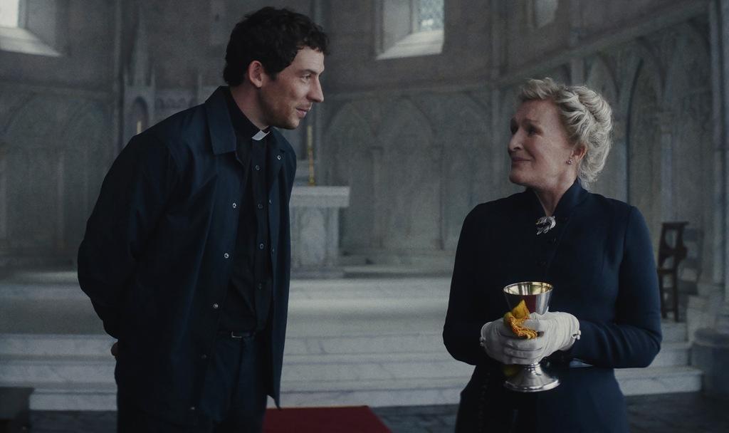 Rev. Jud (Josh O’Connor) and Martha (Glenn Close), in "Wake Up Dead Man: A Knives Out Mystery." (Netflix)