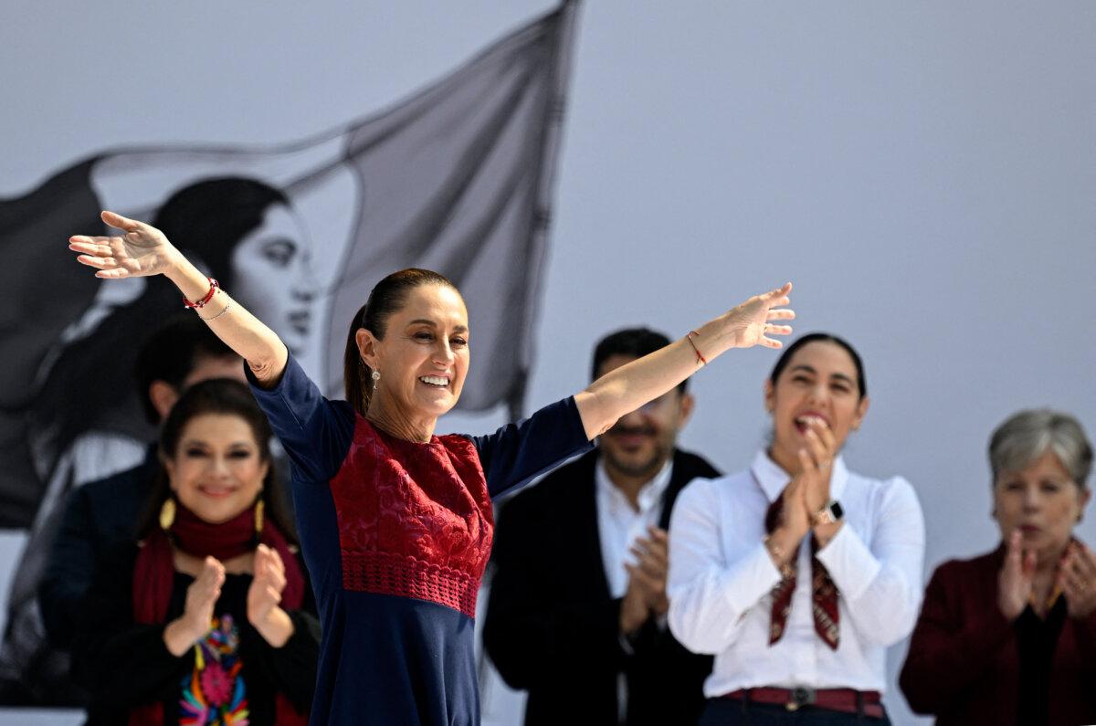 Mexican President Claudia Sheinbaum gestures on arrival for the rally marking the seventh anniversary of the Morena party in government in Mexico City on Dec. 6, 2025. Sheinbaum called for a massive rally to reaffirm her leftist government after a turbulent month marked by political violence and the abrupt resignation of the attorney general. (Alfredo Estrella/AFP via Getty Images)