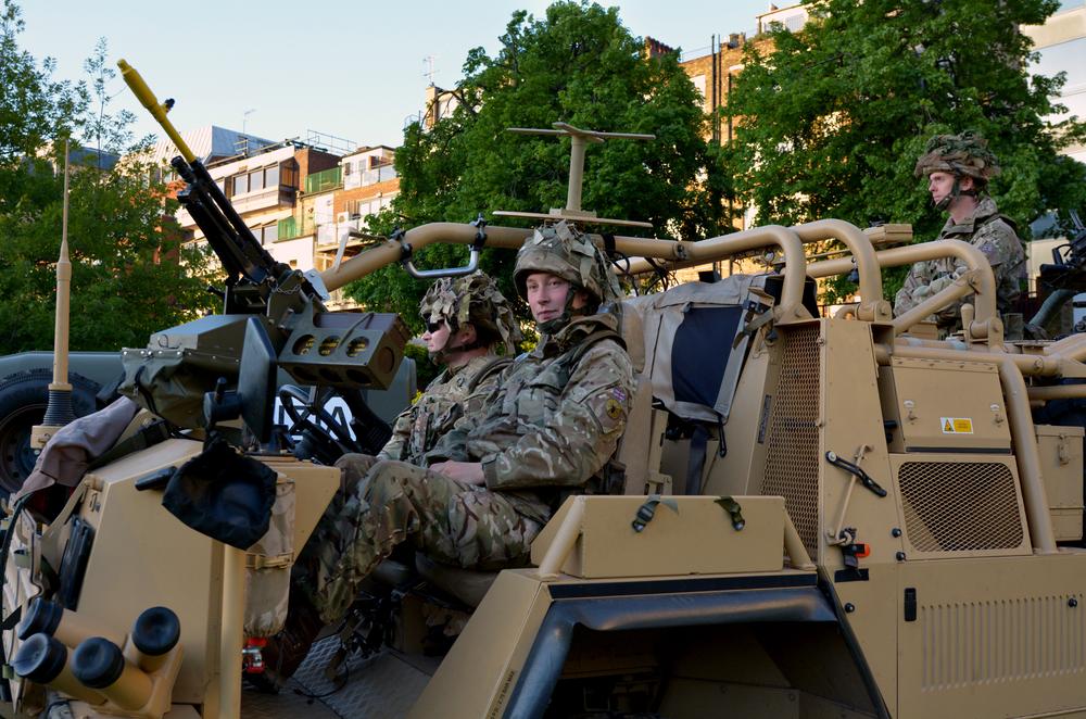 British soldiers of the Special Air Service (SAS) in armed vehicle. (ChameleonsEye/Shutterstock)