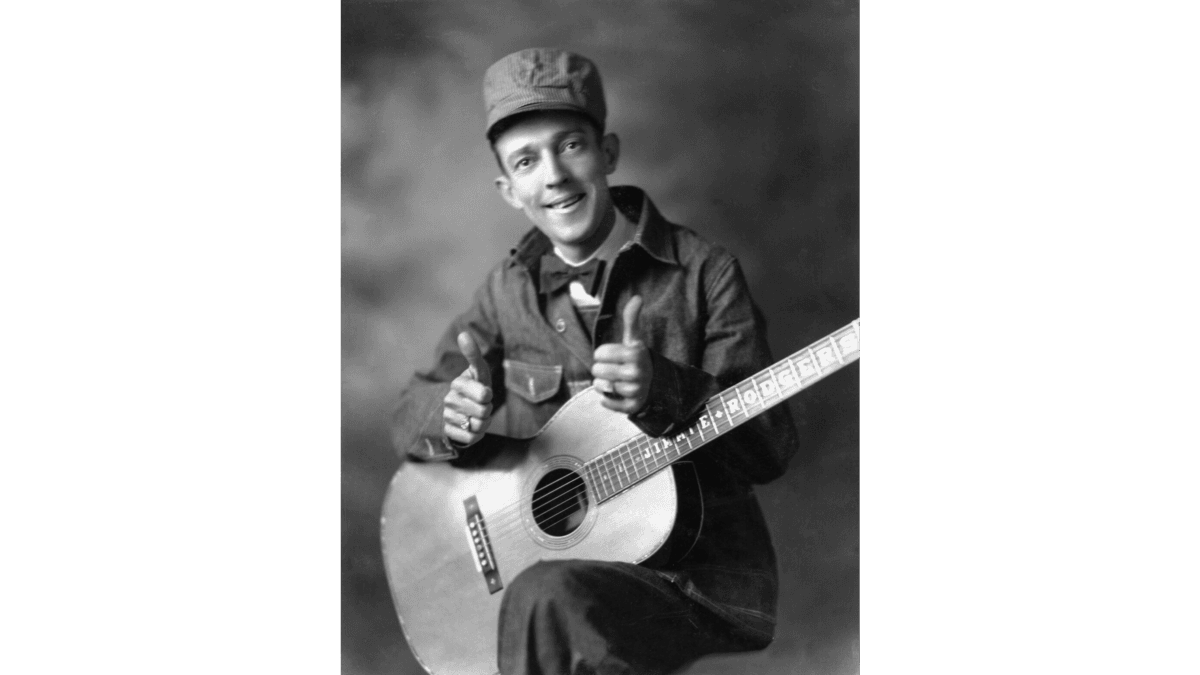 Publicity portrait of American singer Jimmie Rodgers dressed as the “Singing Brakeman,” 1931. (Public Domain)