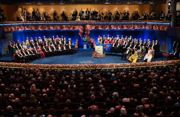 Day in Photos: Nobel Prize Award Ceremony, 2 Buildings Collapse in Morocco, Flooding in England