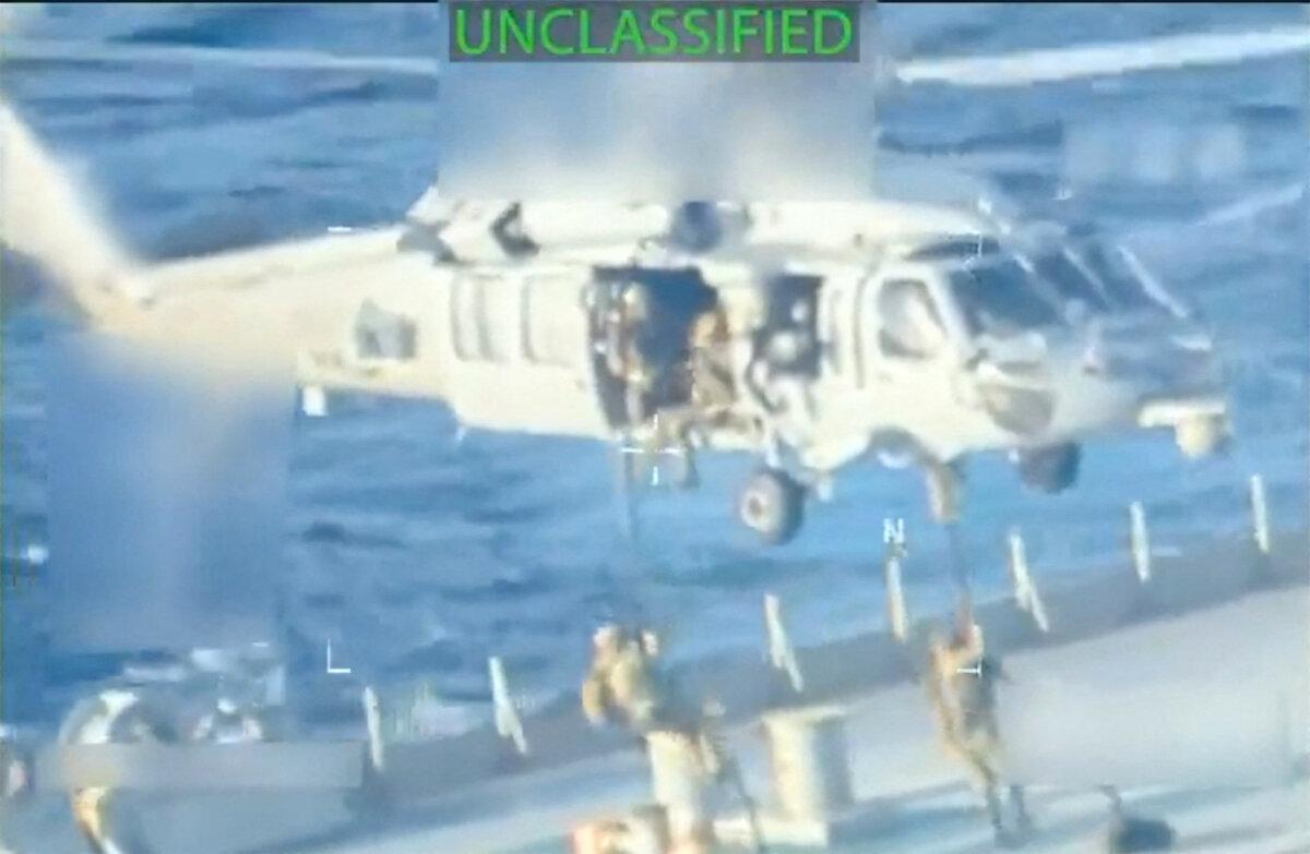 In a still image from a video, U.S. forces abseil onto an oil tanker during a raid described by U.S. Attorney General Pam Bondi as its seizure by the United States off the coast of Venezuela, on Dec. 10, 2025. (U.S. Attorney General/Reuters)