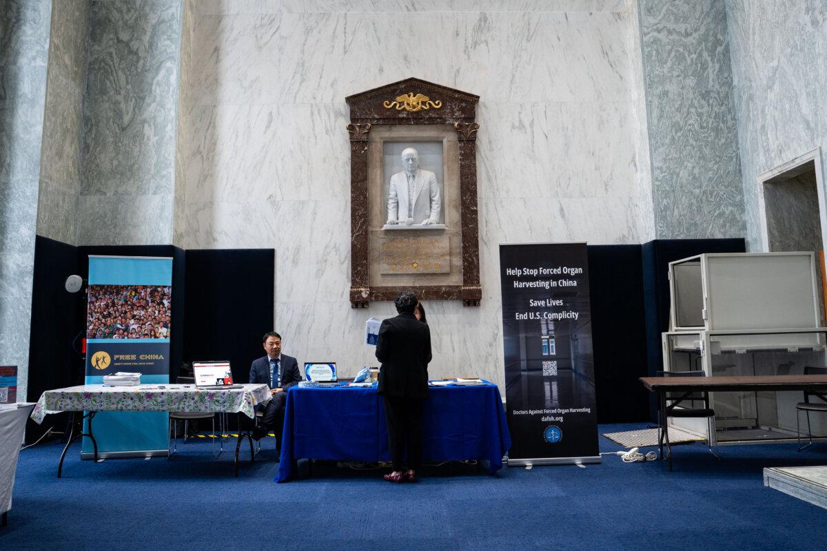 Doctors Against Forced Organ Harvesting booth at the China Human Rights Advocacy Fair at the Rayburn House Office Building in Washington on Dec. 10, 2025. (Madalina Kilroy/The Epoch Times)