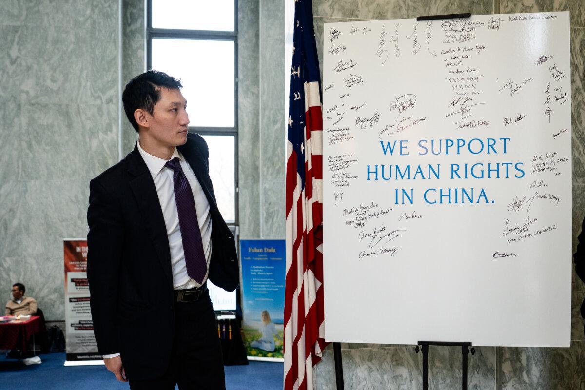 Steven Wang, a Shen Yun dancer, at the China Human Rights Advocacy Fair at the Rayburn House Office Building in Washington on Dec. 10, 2025. (Madalina Kilroy/The Epoch Times)