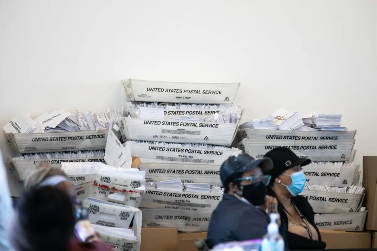 FBI Says 2020 Election Irregularities at Center of Georgia Investigation | USNN World News Security envelopes for absentee ballots sit in stacked boxes as Fulton County workers continue to count absentee ballots at State Farm Arena in Atlanta on Nov. 6, 2020. (Jessica McGowan/Getty Images)