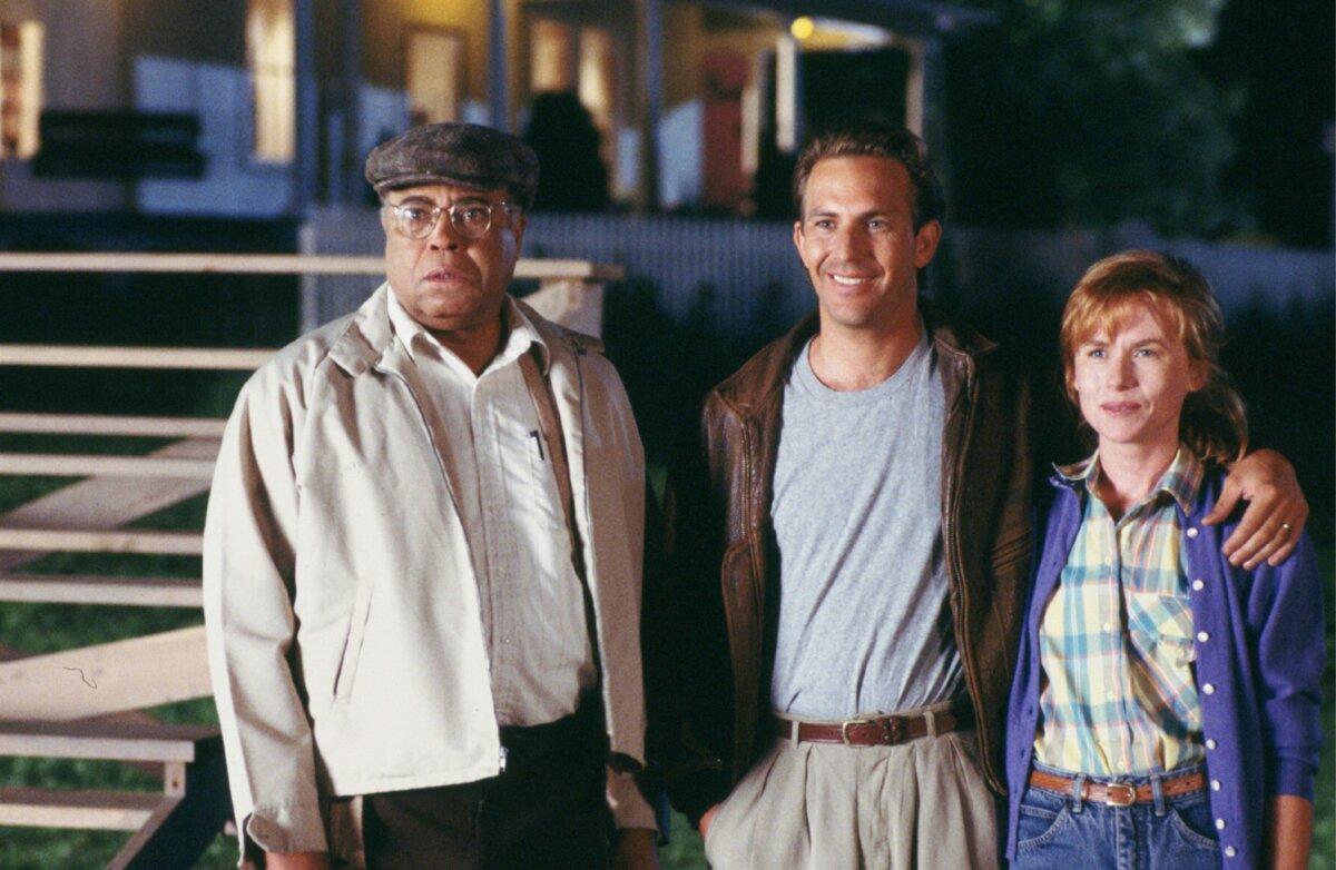 (L–R) Terence Mann (James Earl Jones), Ray Kinsella (Kevin Costner), and Annie Kinsella (Amy Madigan), in “Field of Dreams.” (Caralco Pictures/MovieStillsDB)