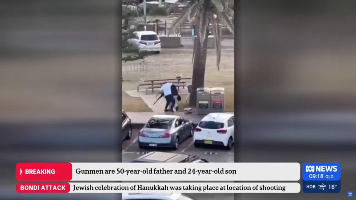 In a screenshot taken from an ABC News 24 livestream video on Dec. 15, 2025, Ahmed Al Ahmed (white shirt) seizes a gun from one of the shooters at Bondi Beach in Sydney, Australia, on Dec. 14, 2025. (AAP Image/Supplied, ABC News)