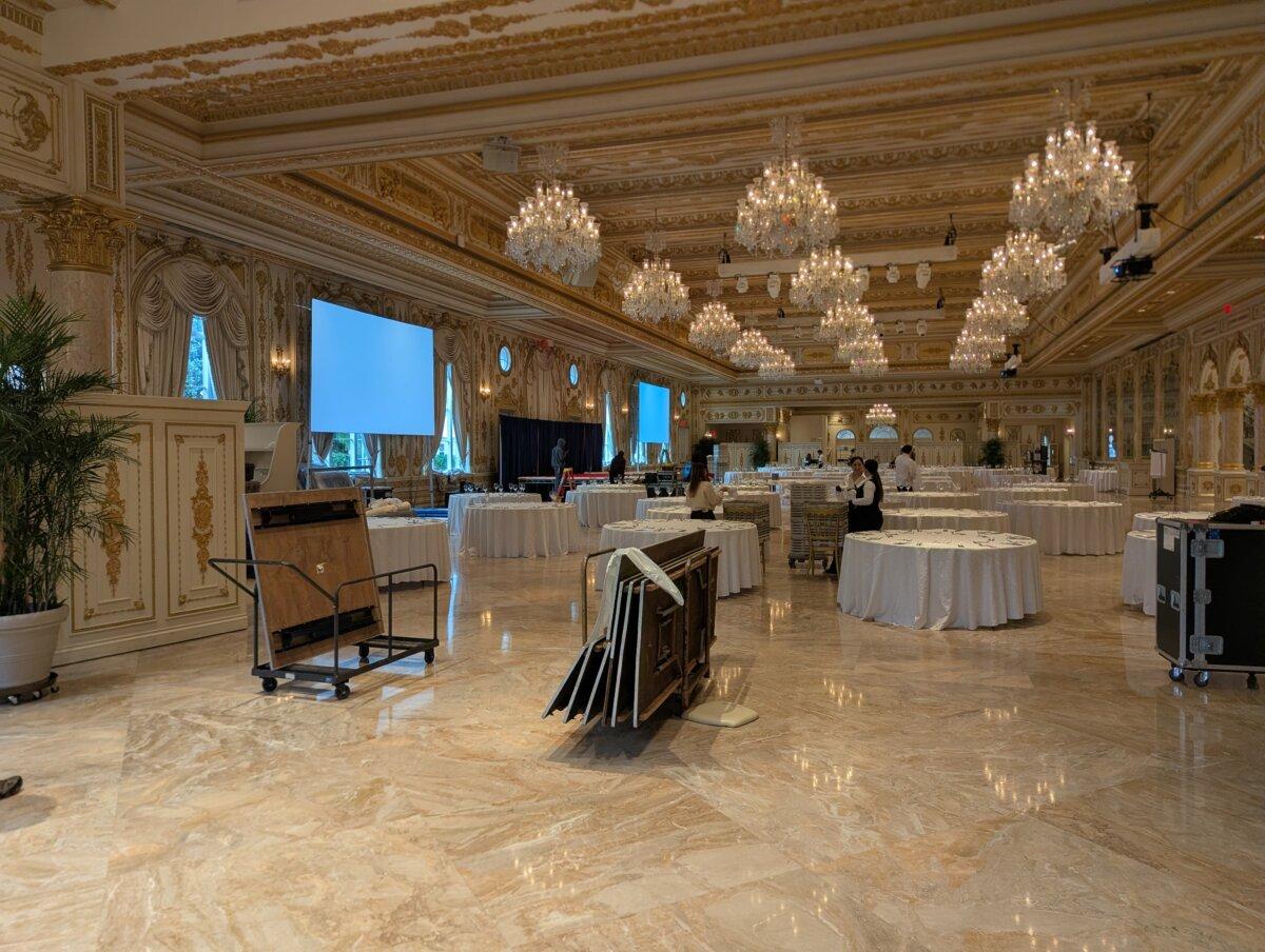 Event staff prepare the ballroom at the Mar-a-Lago club in Palm Beach, Fla., on Dec. 15, 2025, ahead of America's Future's second annual Champions For America Celebration Gala. (Ryan Morgan/The Epoch Times)