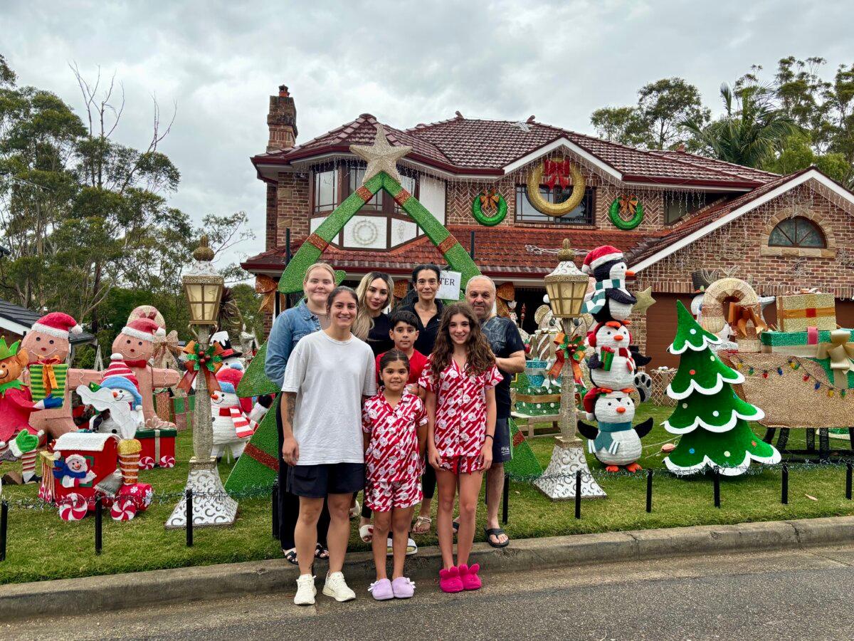 Sylvana Michael (2nd from the left in the back row), and mother Carmela Michael (to her right) with the Michael family at their Castle Hill home in Sydney, Australia. (Epoch Times Sydney staff)